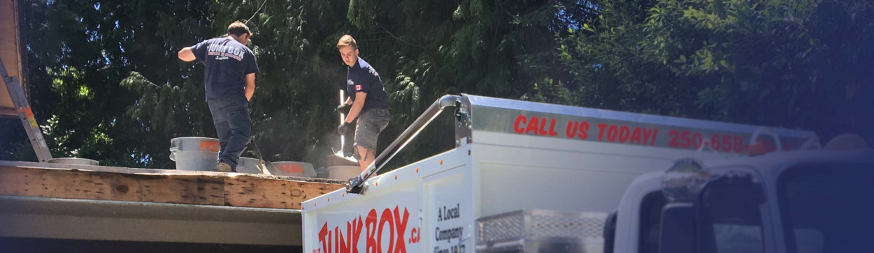 The boys loading renovation material into the truck