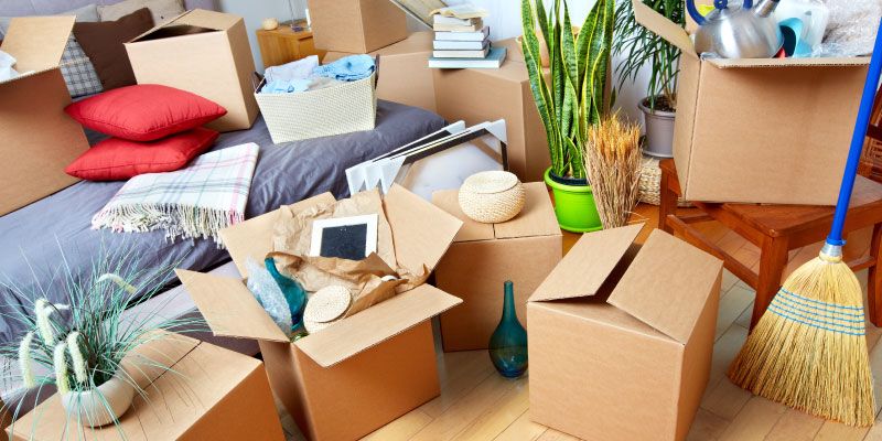 Cluttered living room full of boxes