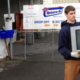 Feller loading tv into junk truck