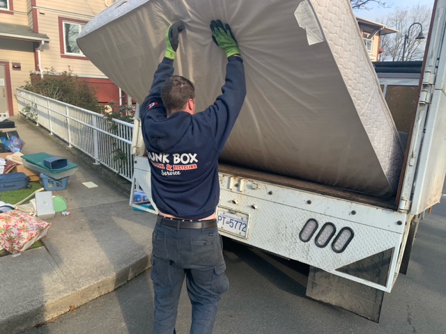 Mattress getting loaded into truck