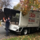 hauling old furniture into truck